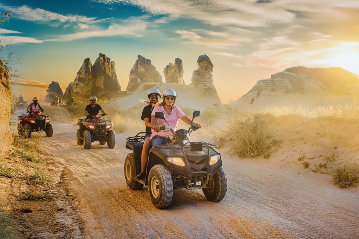 Two ATVs driving through Red Valley in Cappadocia during sunset