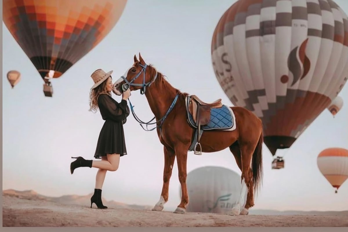 Horseback riders exploring Cappadocia’s fairy chimneys at golden hour